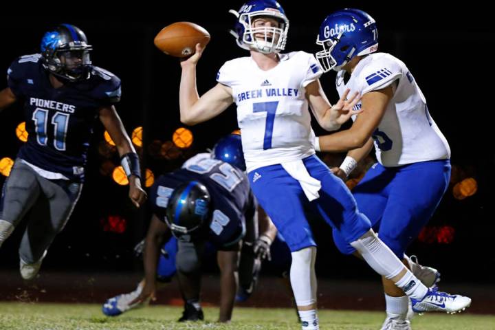 Green Valley's Garrett Castro (7) passes against Canyon Springs in the first quarter of a footb ...