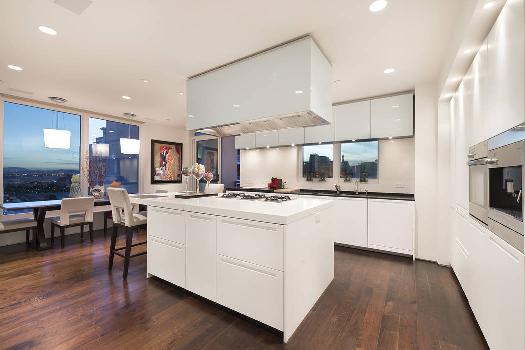 This Park Towers condo features a white kitchen with a sleek, modern design. (Ivan Sher Group)