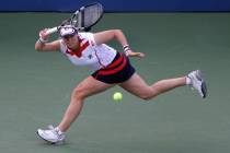 FILE - In this Aug. 29, 2012, file photo, Kim Clijsters returns a shot to Laura Robson in the s ...