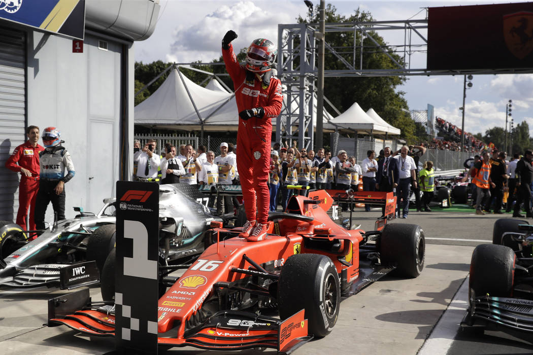 Ferrari driver Charles Leclerc of Monaco celebrates after winning the Formula One Italy Grand P ...