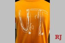 This photo shows a University of Tennessee shirt using the design of a fourth-grader who was bu ...