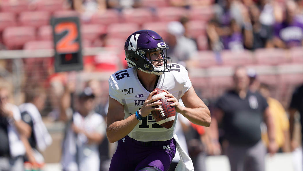 Northwestern quarterback Hunter Johnson (15) in action against Stanford in the first half durin ...