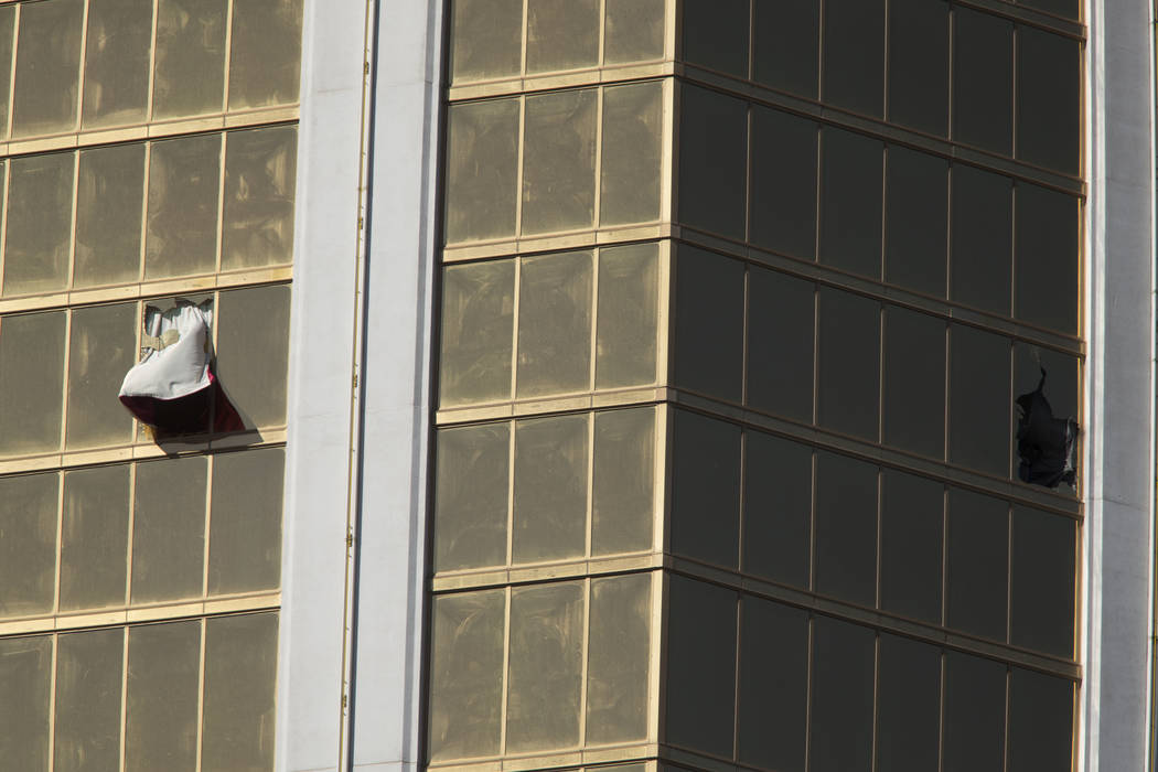 Broken windows at Mandalay Bay in Las Vegas on Oct. 2, 2017, after a shooting left 58 people de ...