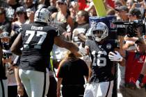 Oakland Raiders wide receiver Tyrell Williams (16) is greeted by offensive tackle Trent Brown ( ...