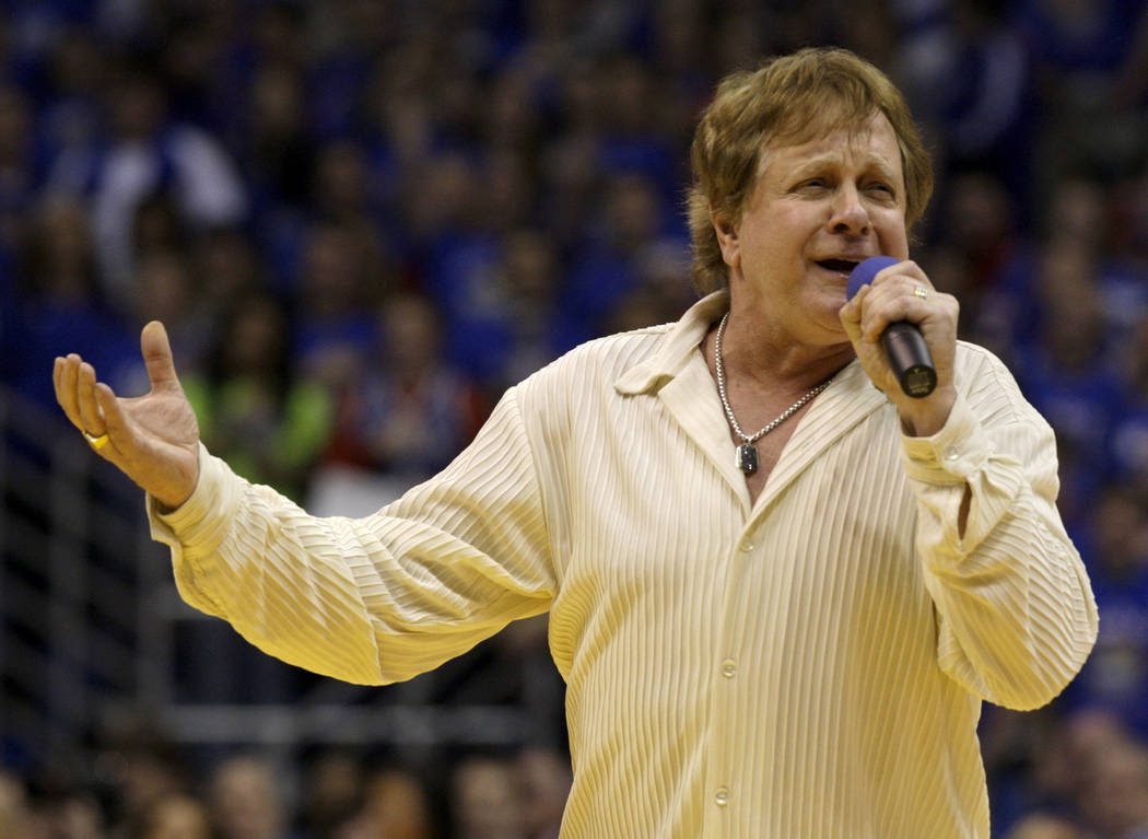 Eddie Money sings the national anthem before an NCAA college basketball game between Kansas and ...