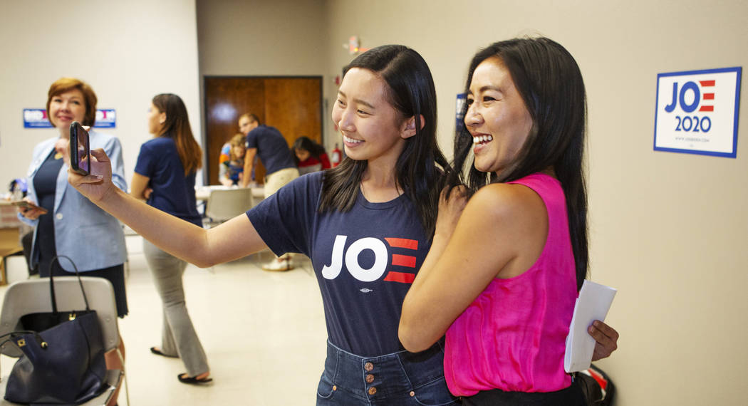 Joe Biden campaign staffer Krystal Sun, left, takes a selfie with Michelle Kwan, two-time Olymp ...