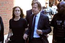 Felicity Huffman arrives at federal court with her husband William H. Macy for sentencing in a ...