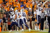 Brigham Young running back Ty'Son Williams (5) celebrates the game-winning touchdown with teamm ...