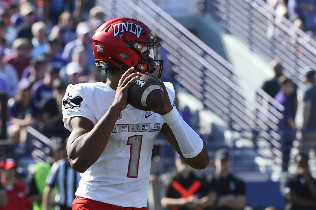 UNLV quarterback Armani Rogers (1) looks pass during the first half of an NCAA college football ...
