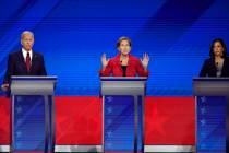 Former Vice President Joe Biden, left, and Sen. Kamala Harris, D-Calif., right, listen as Sen. ...