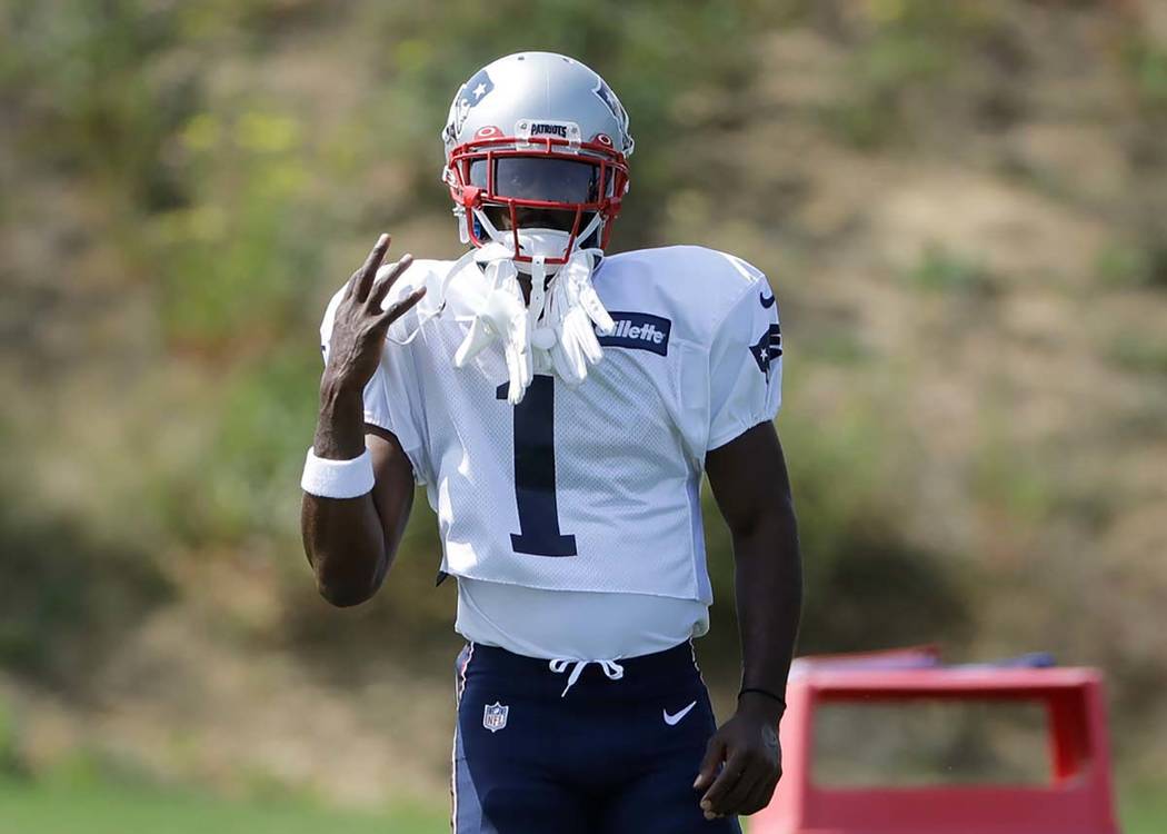 New England Patriots wide receiver Antonio Brown works out during an NFL football practice, Wed ...