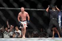 Justin Gaethje, left, reacts to his technical knockout win against Michael Johnson in The Ultim ...