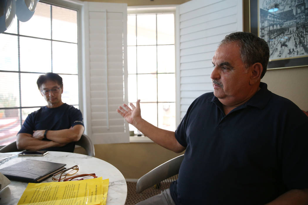Victor Padron, right, with his neighbor Wayne Niimi, talks about a rehab center that opened nex ...