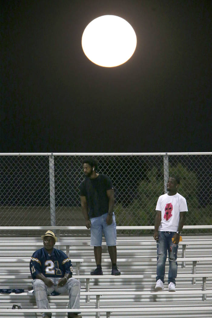 The Harvest Moon rises behind the bleachers during a game between Clark and Chaparral at Chapar ...