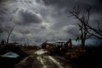 Mos Antenor, 42, drives a bulldozer while clearing the road after Hurricane Dorian Mclean's Tow ...