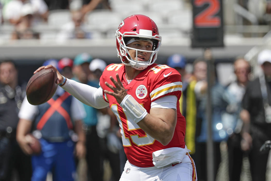Kansas City Chiefs quarterback Patrick Mahomes throws a pass during the first half of an NFL fo ...
