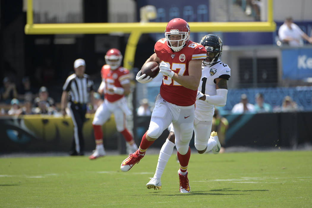 Kansas City Chiefs tight end Travis Kelce (87) runs after catching a pass from quarterback Patr ...