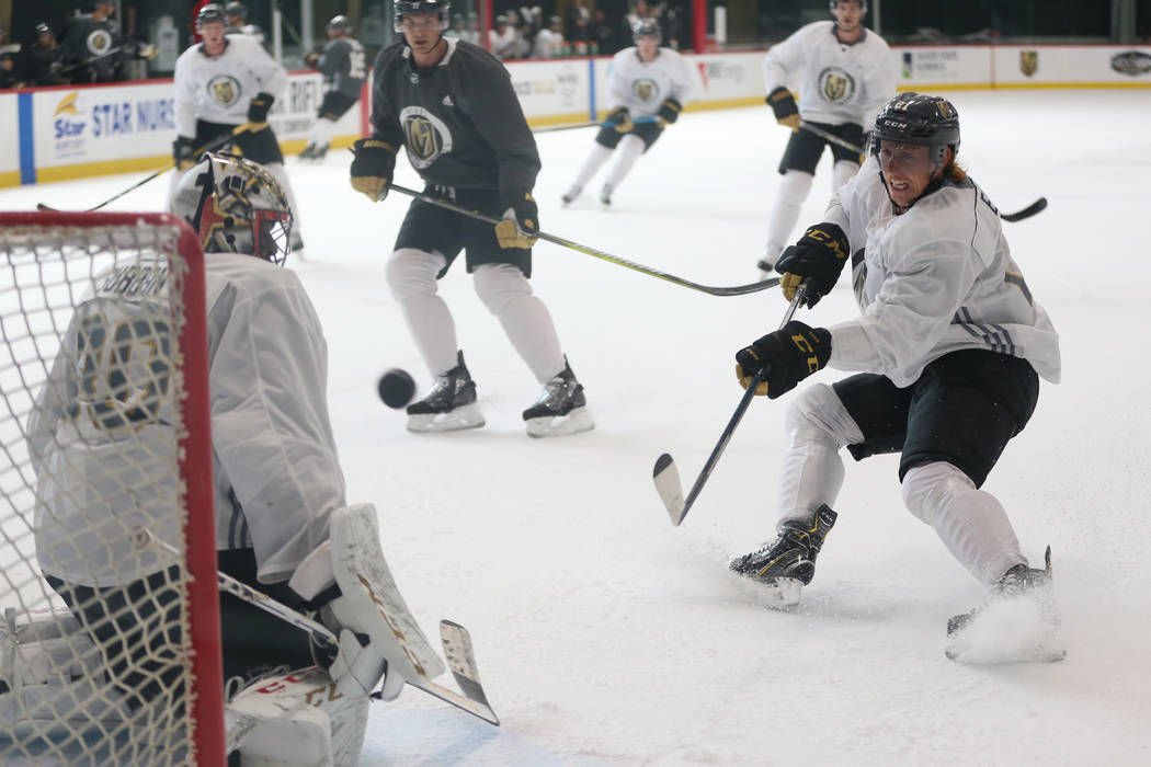 Vegas Golden Knights center Cody Eakin (21) shoots the puck for a score against goaltender Malc ...