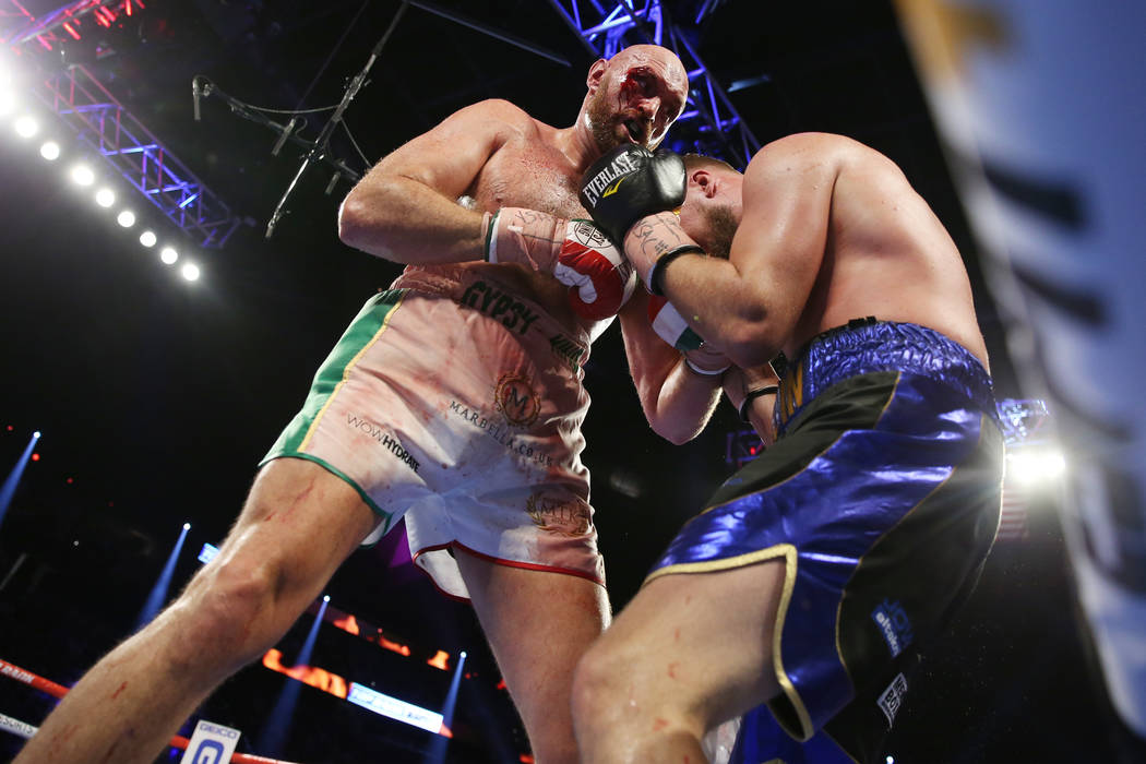 Tyson Fury, left, battles Otto Wallin in the 11th round of the heavyweight bout at T-Mobile Are ...