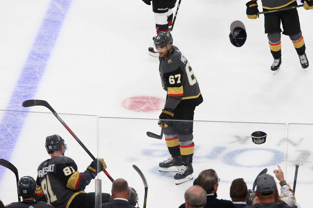 Hats fly onto the ice after Vegas Golden Knights left wing Max Pacioretty (67) scored his third ...