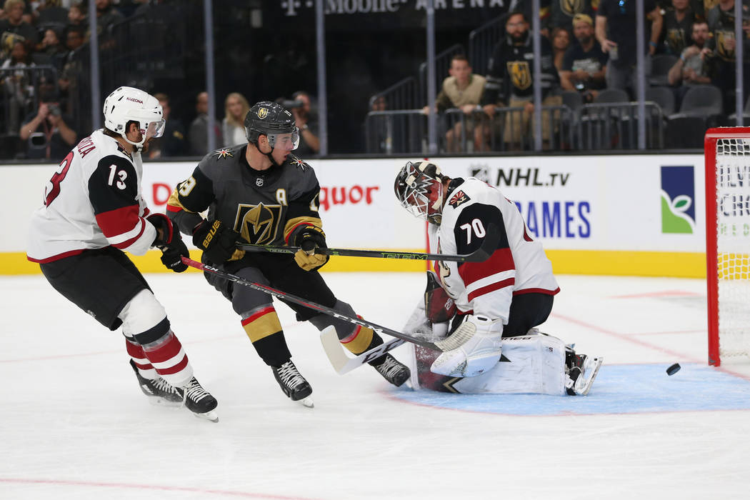 Vegas Golden Knights right wing Reilly Smith (19) shoots for a score against Arizona Coyotes go ...