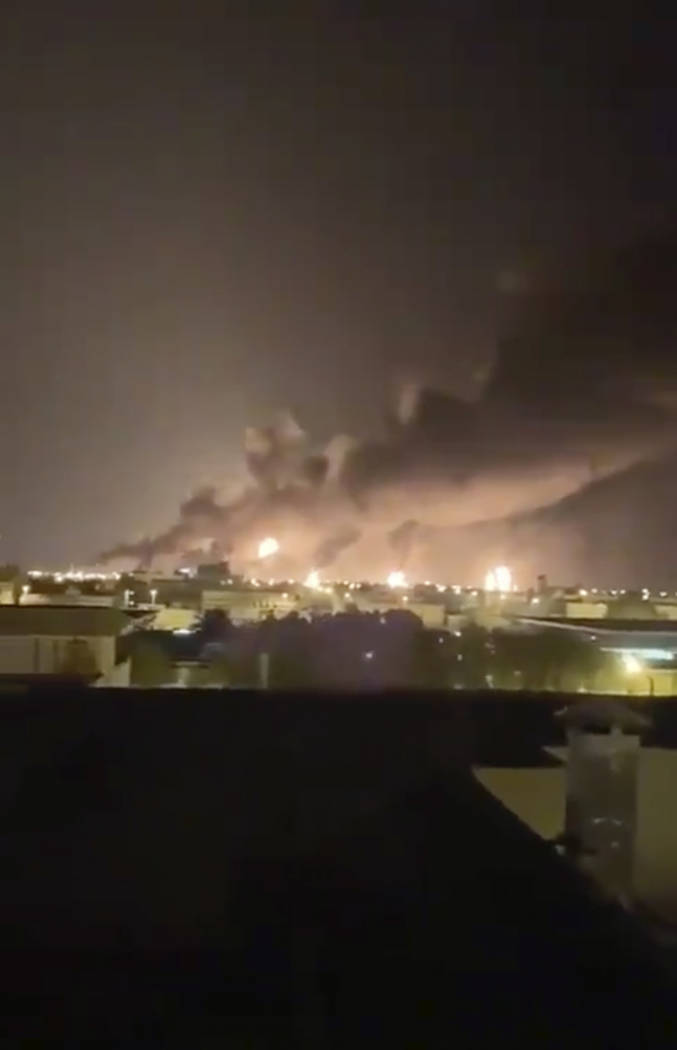 Smoke fills the sky at the Abqaiq oil processing facility on Saturday, Sept. 14, 2019 in Saudi ...