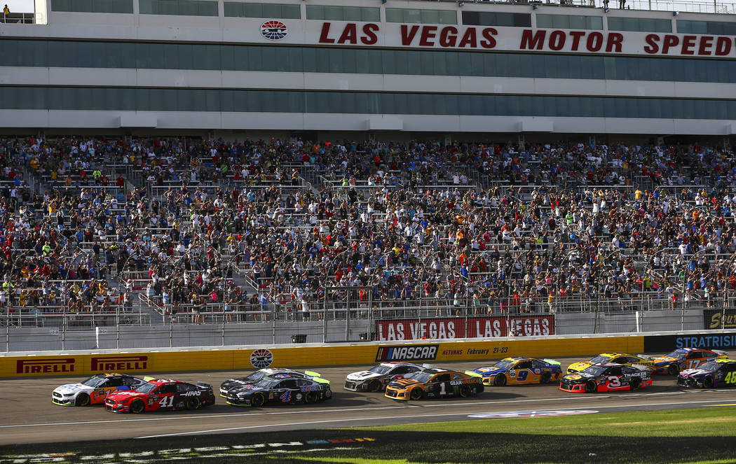 Cars round the track during a NASCAR Cup Series auto race at Las Vegas Motor Speedway, Sunday, ...