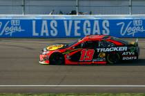 Martin Truex Jr. (19) drives during a NASCAR Cup Series auto race at Las Vegas Motor Speedway, ...