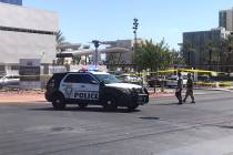 Las Vegas police are investigating reports of a suspicious package Sunday morning near downtown ...