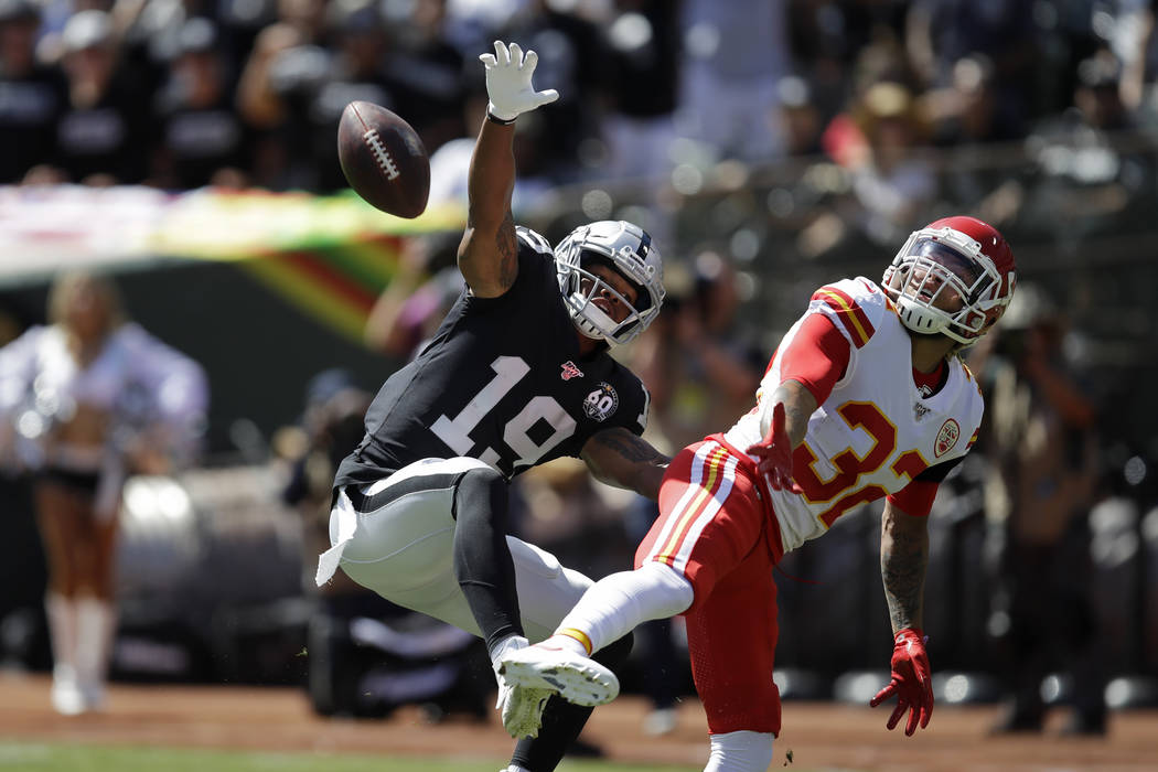Oakland Raiders wide receiver Ryan Grant (19) goes up for a pass as Kansas City Chiefs strong s ...