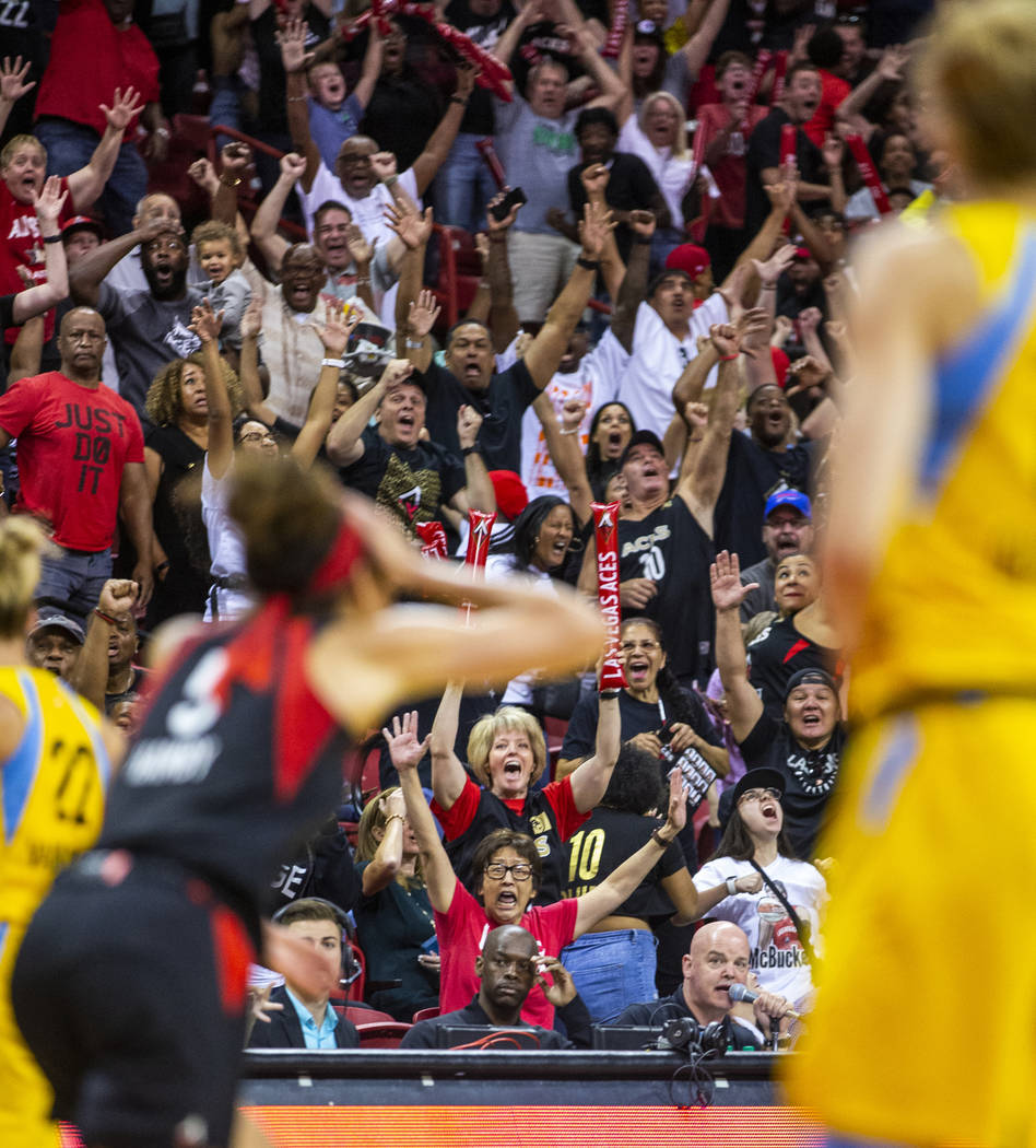 Fans go crazy after Las Vegas Aces forward Dearica Hamby (5) makes a late-game three-point-shot ...