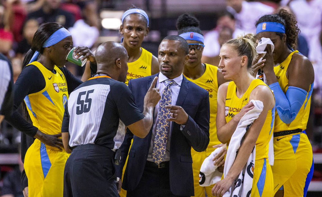 Chicago Sky head coach James Wade has a foul shot rule explained to him and his players by a re ...