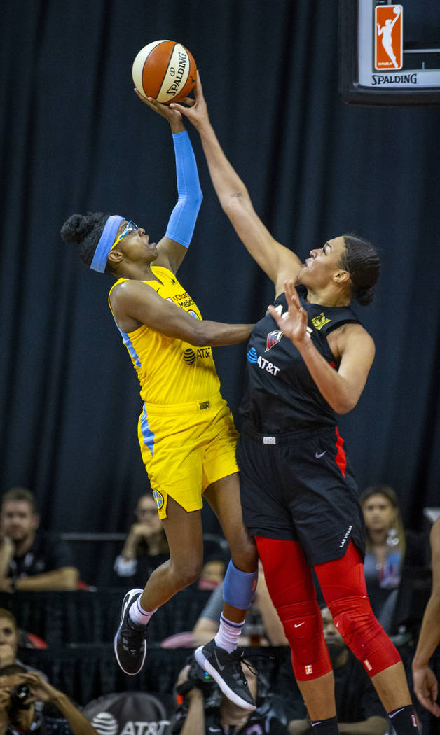 Chicago Sky guard Diamond DeShields (1) has a shot attempt blocked by Las Vegas Aces center Liz ...