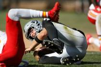 Oakland Raiders quarterback Derek Carr hits the ground after a play during the second half of a ...