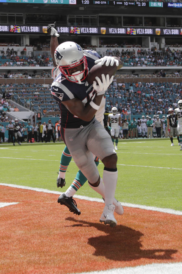 New England Patriots wide receiver Antonio Brown (17) scores a touchdown as Miami Dolphins corn ...