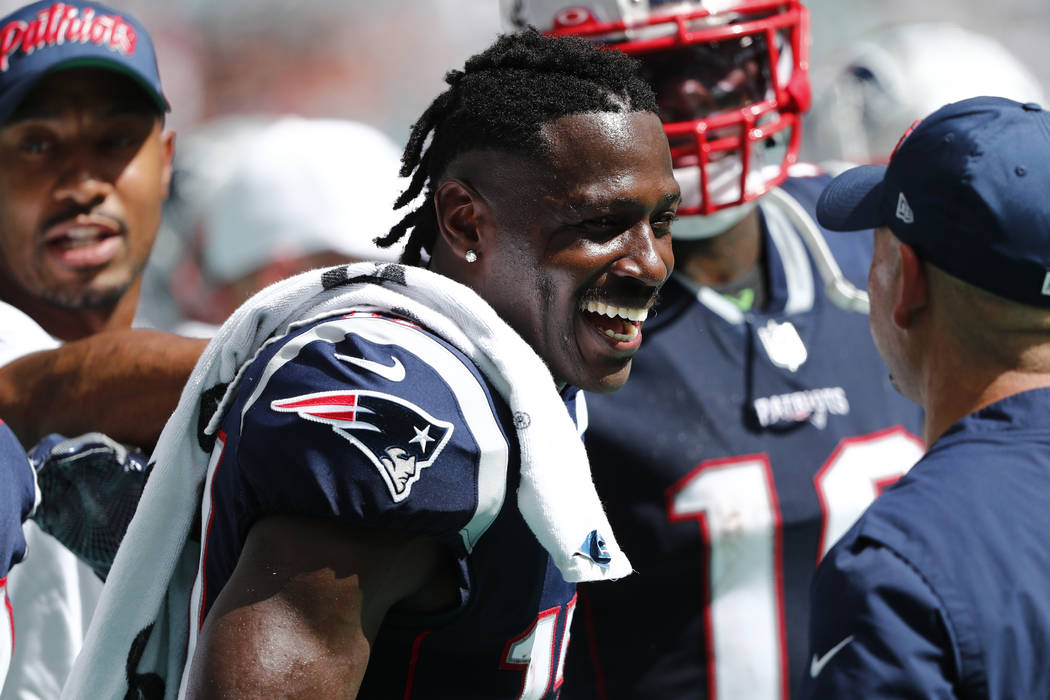 New England Patriots wide receiver Antonio Brown (17) smiles on the sidelines, during the secon ...