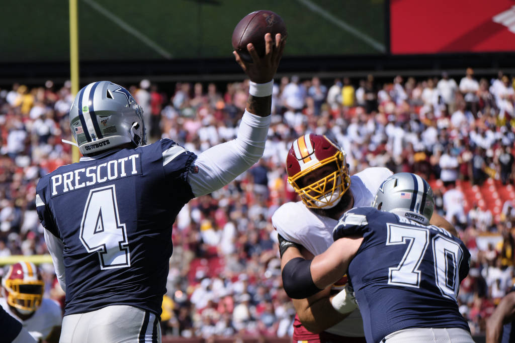 Dallas Cowboys quarterback Dak Prescott (4) throws during an NFL football game against the Wash ...