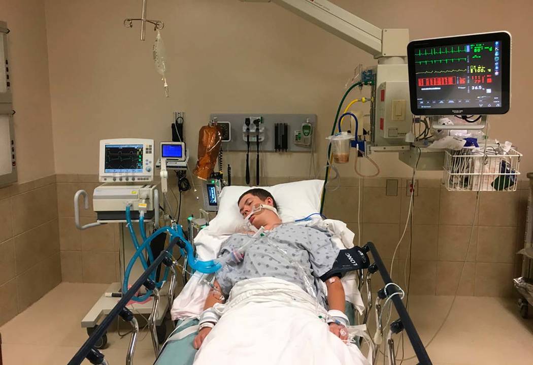 This May 2018, photo provided by Joseph Jenkins shows his son, Jay, in the emergency room of th ...