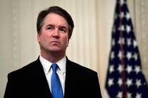 In this Oct. 8, 2018, file photo, Supreme Court Justice Brett Kavanaugh stands before a ceremon ...