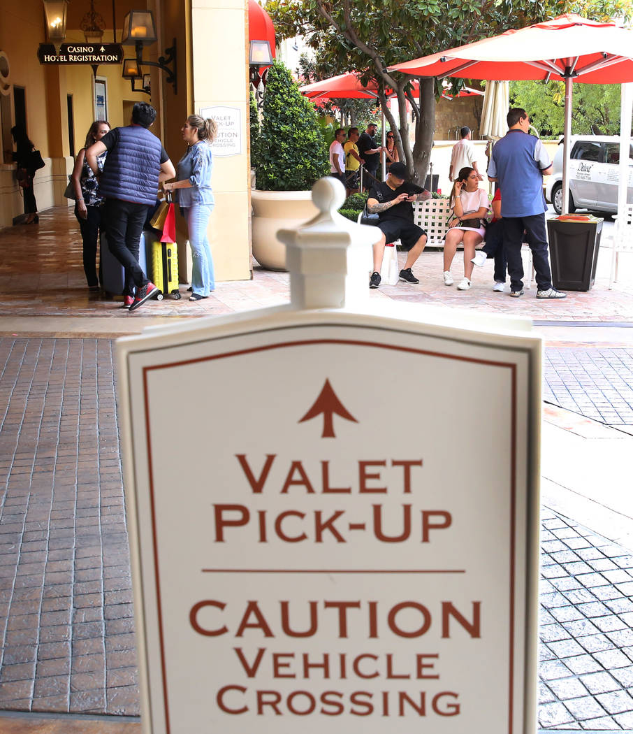 Hotel guests at Wynn Las Vegas wait for their cars at valet parking pick-up area on Monday, Sep ...