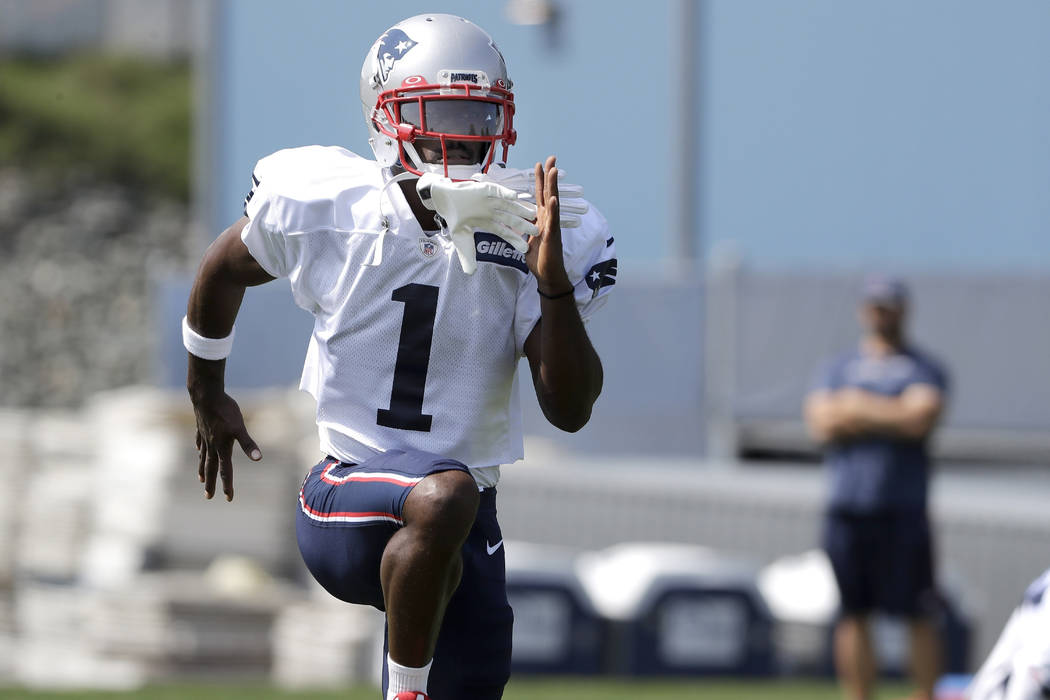 New England Patriots wide receiver Antonio Brown works out during NFL football practice, Wednes ...