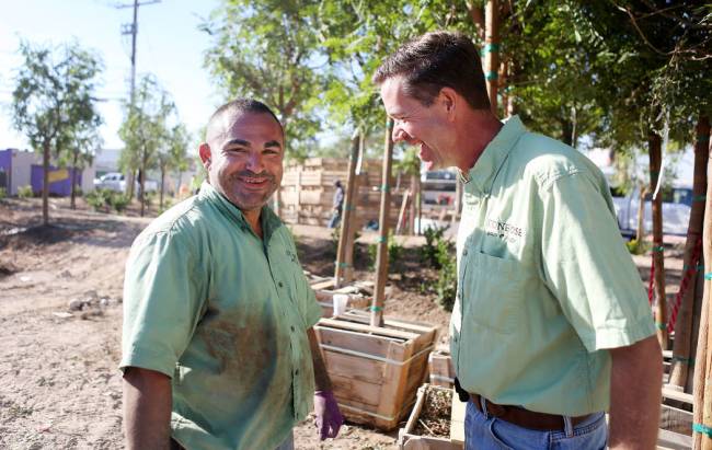 Daniel Perez, left, and Jay Pleggenkuhle, owners of Stonerose Landscapes in Las Vegas, at the m ...