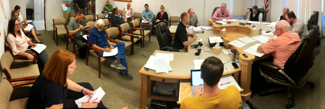Fire Chief Eric Holt, center, as coordinator the Lincoln County Emergency Management team addre ...
