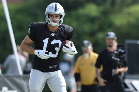Oakland Raiders wide receiver Hunter Renfrow (13) holds on to the football after a catch during ...
