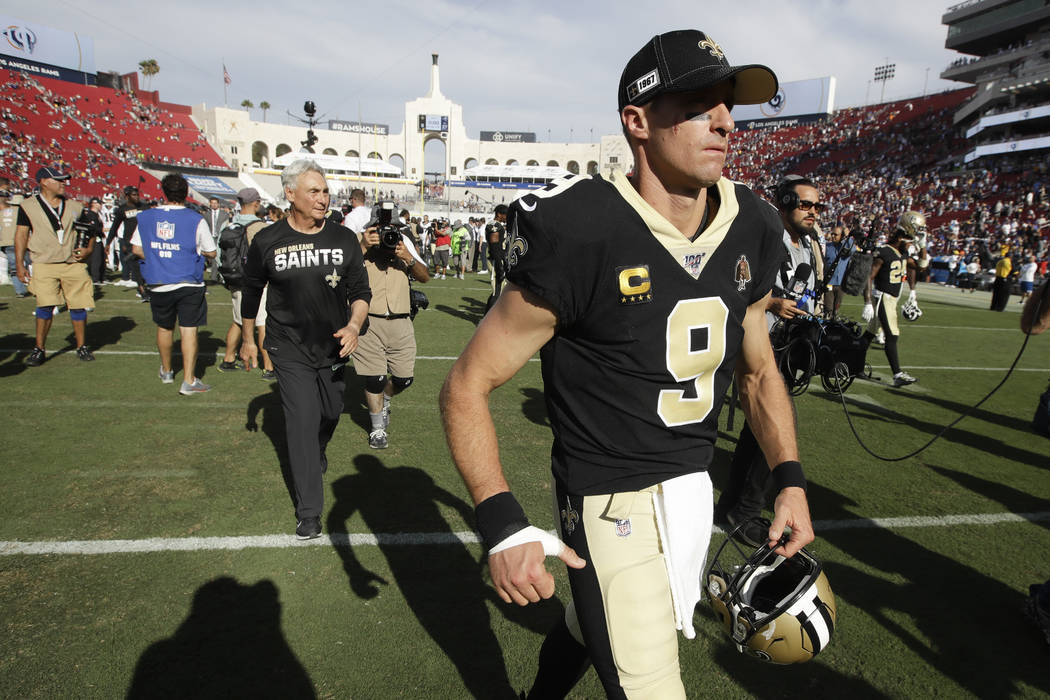 New Orleans Saints quarterback Drew Brees leaves the field after their loss against the Los Ang ...