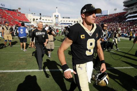 New Orleans Saints quarterback Drew Brees leaves the field after their loss against the Los Ang ...