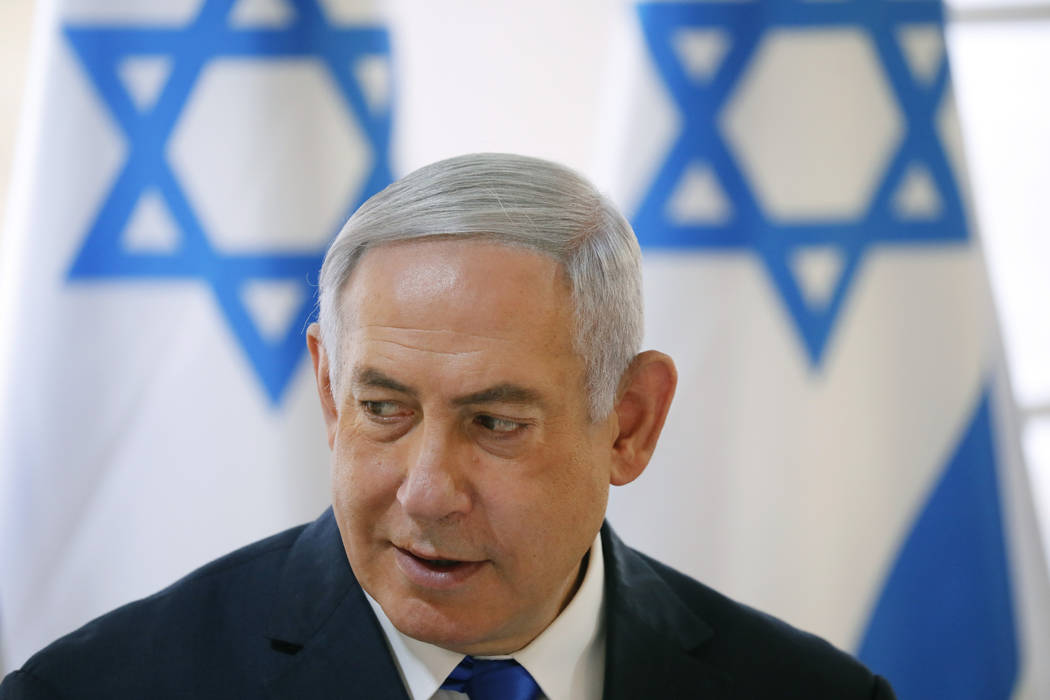 Israeli Prime Minister Benjamin Netanyahu chairs during the weekly cabinet meeting being held i ...