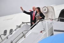Vice President Mike Pence and his wife, Karen, gesture as they arrive at Shannon airport for th ...