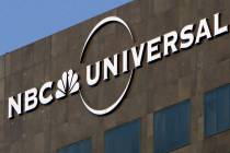 This Dec. 3, 2009, file photo, the NBC Universal logo hangs on a building in Los Angeles. Comca ...