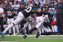 Houston Texans wide receiver DeAndre Hopkins (10) makes a catch in front of Jacksonville Jaguar ...